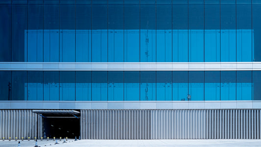 a tall building with a sky background