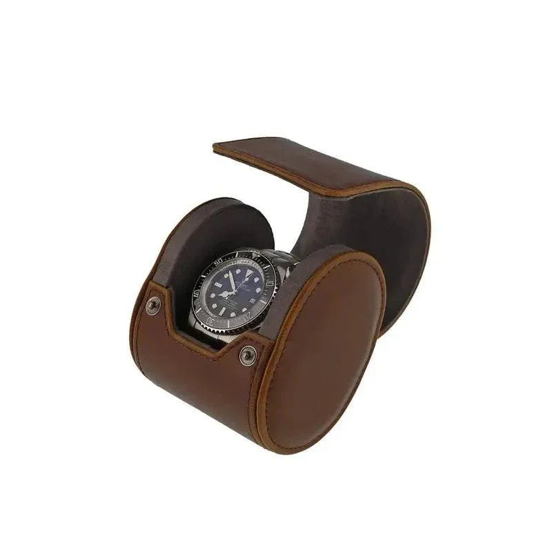 Single Watch Roll in vintage brown leather with super soft grey suede lining displays a wristwatch with a black dial, shown open against a plain white background.