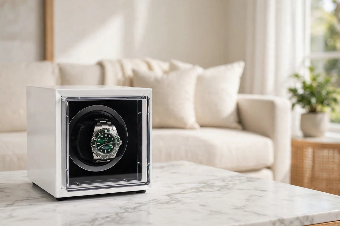 Aevitas Single Watch Winder in White Gloss with an automatic dive watch inside, on a marble table in a bright modern living room