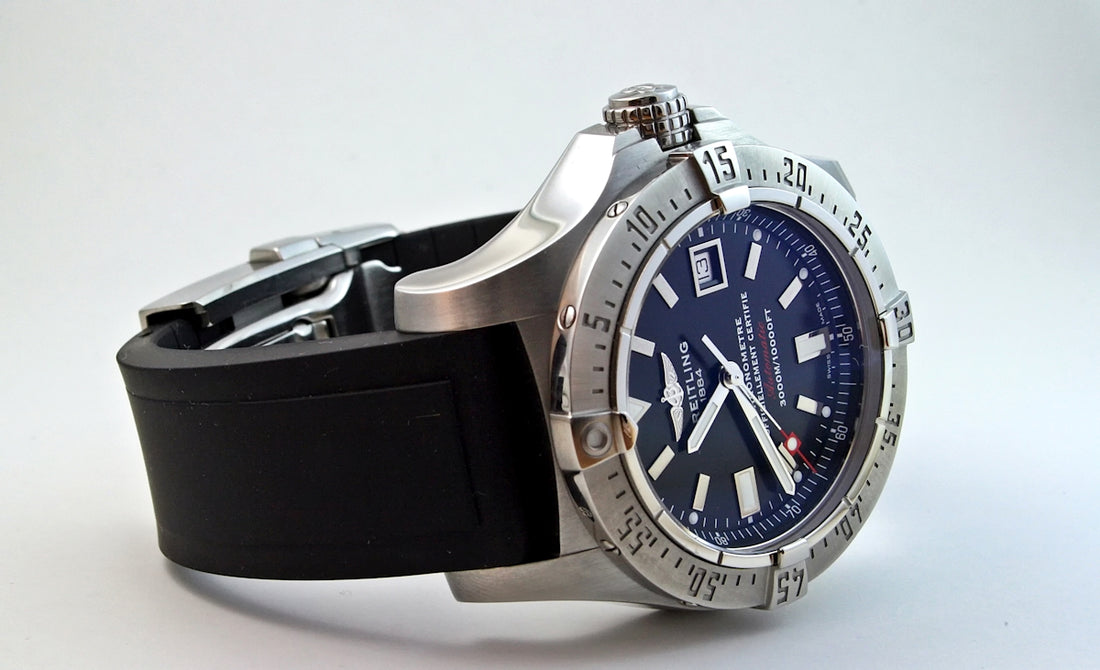 round silver-colored case analog watch displaying 11:46