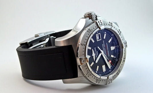 round silver-colored case analog watch displaying 11:46