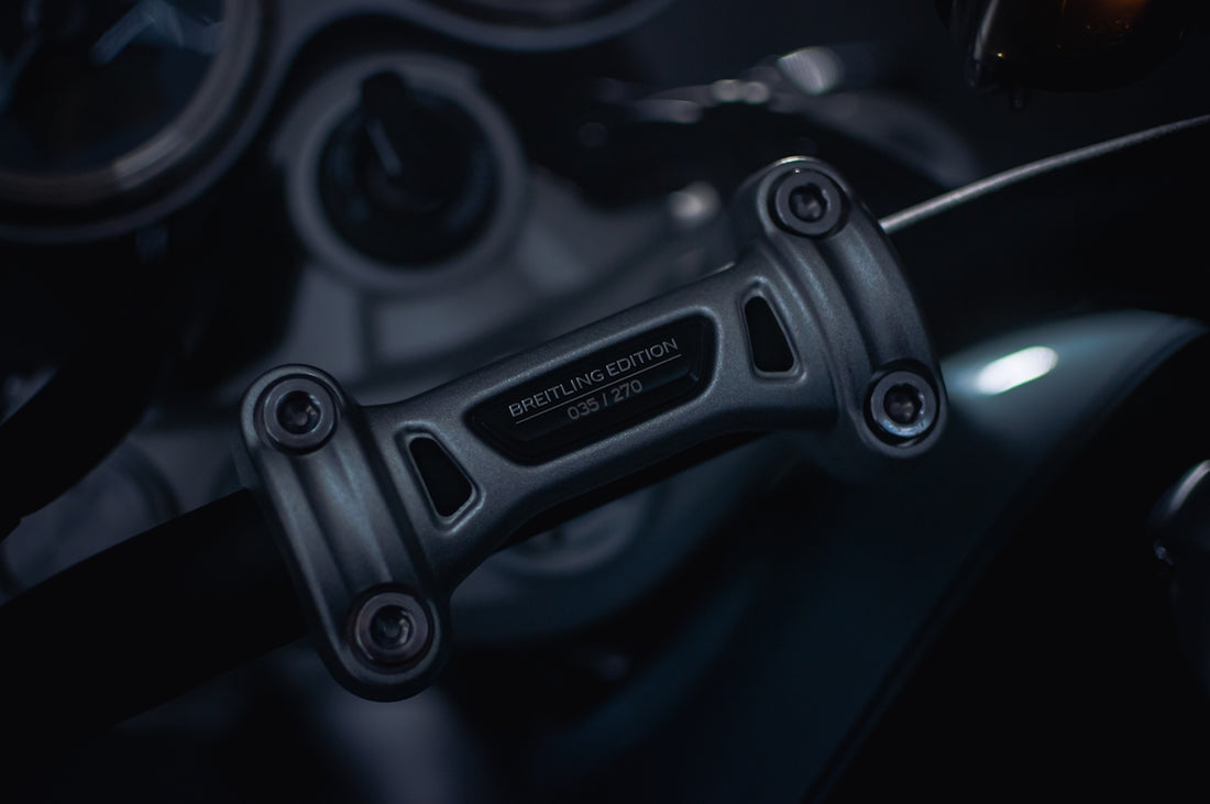 A close up of a motorcycle steering wheel