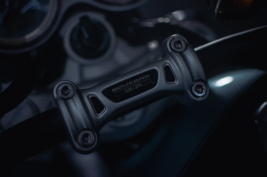 A close up of a motorcycle steering wheel