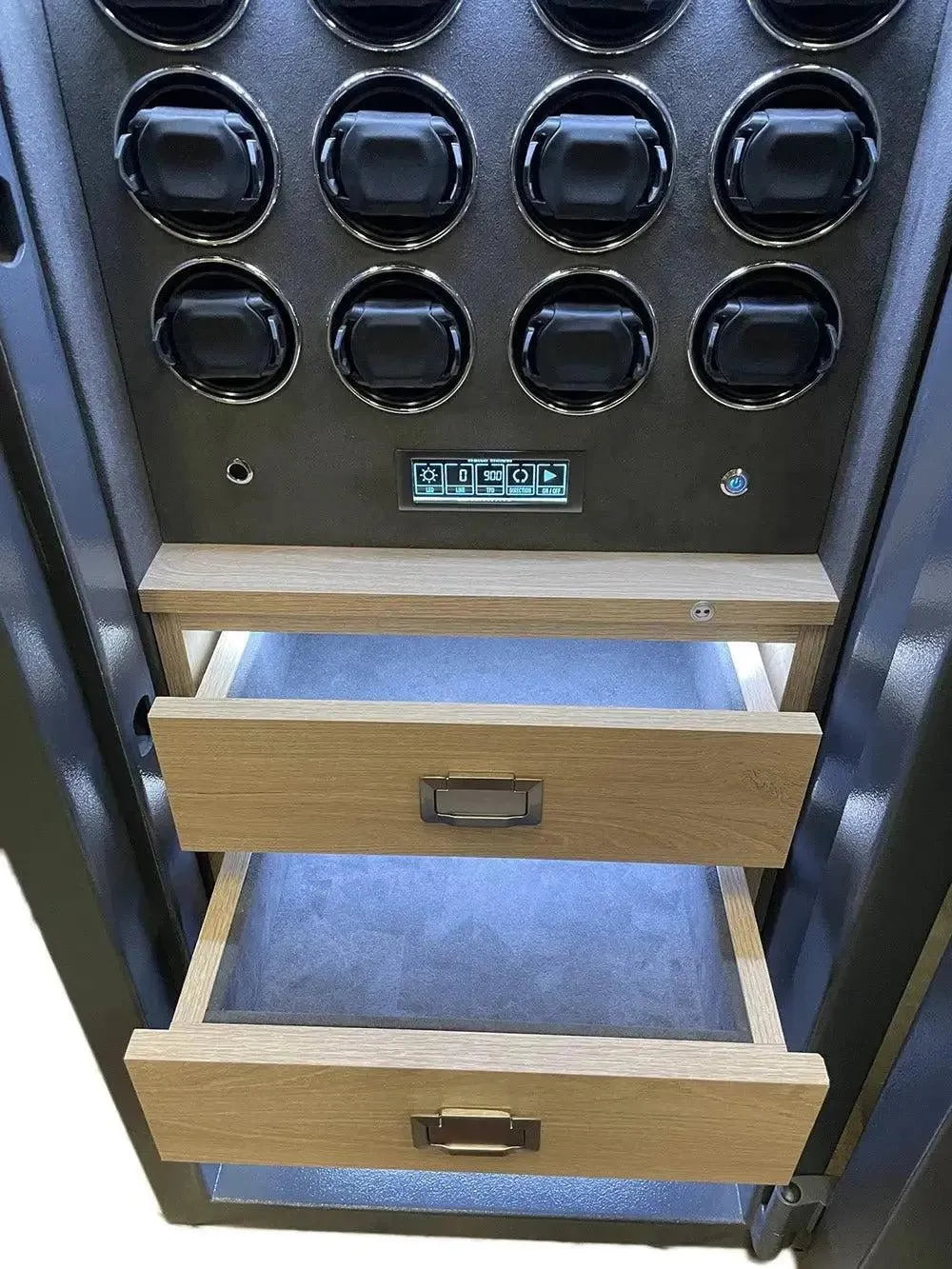 Open wooden drawers beneath a panel of circular black holders and electronic controls, part of the Tempus Luxury Watch Winders 12 Watch Winder Safe Grade 2, with a £175,000 insurance rating for securing automatic timepieces.