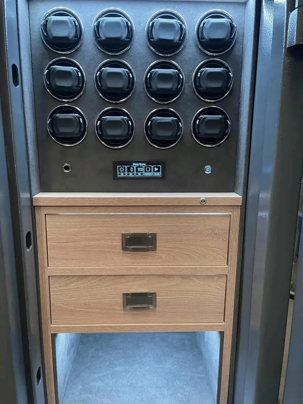 The Tempus Luxury Watch Winders 12 Watch Winder Safe Grade 3 offers secure storage for 12 watches with £350,000 insurance rating, digital controls, display, twelve black dials in three rows, and two wooden drawers for luxurious organization.