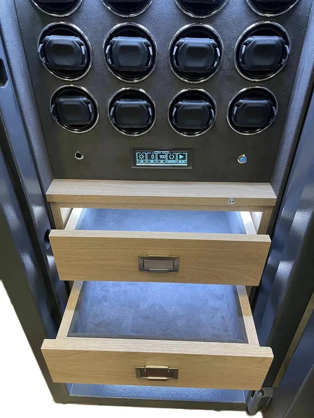 A close-up of the Tempus Luxury Watch Winders 12 Watch Winder Safe Grade 3 (£350,000 insurance rating) shows two open wooden drawers and multiple black watch holders above a small control panel, all highlighted by the well-lit interior.